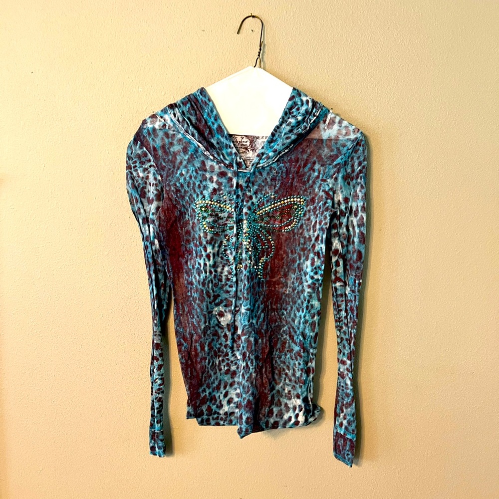 Turquoise leopard pullover with butterfly accent